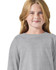 A grey long sleeve t-shirt designed for youth, featuring a relaxed fit and a branding logo.