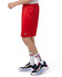 Red mesh sports shorts with pockets, featuring a logo, worn with white and red striped socks and athletic shoes.