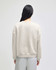 A women's crewneck sweatshirt in light grey, featuring a relaxed fit and simple design on the back.