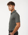 A men's polo shirt in heather melange dark grey with a collar and short sleeves, featuring a logo.
