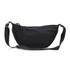A black crossbody bag with a curved shape, featuring a zip closure and adjustable strap. It has a simple design with a logo.