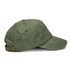 A vintage washed cap in olive green with a curved brim and an adjustable strap at the back.