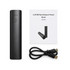 A black cylindrical power bank with a user guide and a USB cable. The power bank features an indicator light.