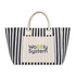 A striped tote bag in navy and cream featuring a pocket with a logo. The bag has sturdy handles for carrying.