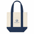A mini canvas tote in cream and navy blue, featuring a logo on the front and sturdy handles.
