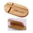 A bamboo mobile holder with a sleek design featuring a logo, designed to hold phones.