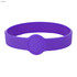 A purple silicone wristband featuring a circular design element and a logo.