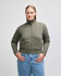 A women's full-zip jacket in olive green, featuring a high collar and ribbed cuffs, with a logo on the sleeve.