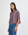 A garment dyed crop boxy T-shirt in a mauve colour, featuring a relaxed fit and short sleeves.