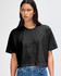 A black heavyweight cotton women's crop boxy T-shirt with short sleeves, displayed on a model.