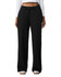 Wide leg pants in black with a drawstring waist, featuring a relaxed fit and pockets. The model is wearing a long-sleeved top.