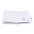 A white FSC notebook with blank pages and a logo on the inside cover, featuring a ribbon bookmark.