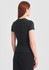 A women's black baby tee viewed from the back, featuring a fitted design and short sleeves.