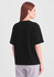 A black box tee is displayed, featuring a relaxed fit and short sleeves. The model is shown from the back.