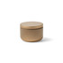 A mini tin candle in a matte gold finish with a simple rounded design and a matching lid.