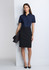 A navy short sleeve shirt paired with a black skirt, displayed on a model against a grey backdrop.