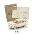 A wooden model SUV in natural colour, with assembled and unassembled pieces displayed alongside a packaging sheet.