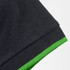 A black polo shirt featuring a green trim on the collar and sleeves, with a logo present.