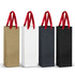 A collection of four champagne ribbon handle paper bags in gold, white, dark grey, and black with red ribbon handles.