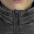 A close-up of a black women's puffer vest collar with a zipper and a branding logo.