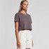 A cropped t-shirt in a muted purple colour, featuring a round neckline and short sleeves, paired with light shorts.