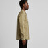 A khaki button-up shirt with a collared neckline and long sleeves, featuring a logo on the chest.
