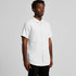 A short-sleeve button-up shirt in white, featuring a front pocket and a collar. The model stands against a plain background.