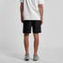 Black beach shorts with an elastic waistband, featuring side pockets and a branding logo.