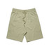 Light green sports shorts with an elastic waistband and drawstring, featuring a logo.