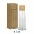 A drink bottle with a clear glass body and a wooden lid, packaged in a simple brown box, featuring a logo.