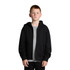 A black zip-up hoodie worn by a young person, featuring a front pocket and a hood. It has a logo on the chest.