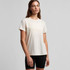 A light cream T-shirt with a relaxed fit, paired with black shorts. The shirt features a logo on it.