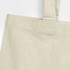 A recycled cotton tote bag in a light beige colour with sturdy shoulder straps and visible stitching details.
