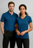 A blue women's short sleeve polo shirt with a v-neck design and a logo on the front.