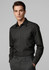 A black long sleeve button-up shirt on a model, featuring a fitted design and a logo on the chest.