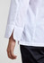A white long sleeve chef jacket featuring split cuffs and a sleek design. It has branding on the fabric.