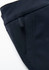 A close-up of a navy women's stretch pant featuring side pockets and a smooth fabric finish.