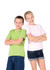 A green and a pink kid's regular T-shirt worn by two children with arms crossed, against a white background.