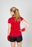 A red women's T-shirt with short sleeves, featuring white accents and a logo, paired with black shorts.