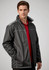 A man models a black unisex reactor jacket with grey accents, featuring zip pockets and a collar.