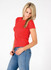 A red slim fit women's T-shirt displayed on a model wearing blue jeans, featuring a logo on the shirt.