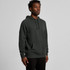 A dark green hoodie with a kangaroo pocket and a drawstring hood, displayed on a model.