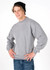A grey poly cotton fleece jumper worn by a person, paired with a black beanie, featuring long sleeves.