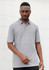 A grey short sleeve polo shirt for men with a subtle design and a logo.