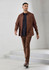 A brown long sleeve button-up shirt worn over a black top, paired with matching brown trousers and shoes.
