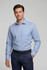 A light blue long sleeve button-up shirt for men, featuring a pocket and paired with dark trousers.