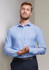 A light blue men's long sleeve button-up shirt with a chest pocket, featuring a subtle logo branding.