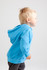 A blue zip hoodie for babies, featuring a hood, modeled by a child. The hoodie has a logo on it.