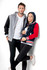 A navy and red women's varsity jacket with a hood, worn by a model alongside a grey version worn by a male model.