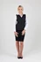 A fitted black soft shell vest with a zippered front, worn over a white shirt and black skirt, featuring a logo.